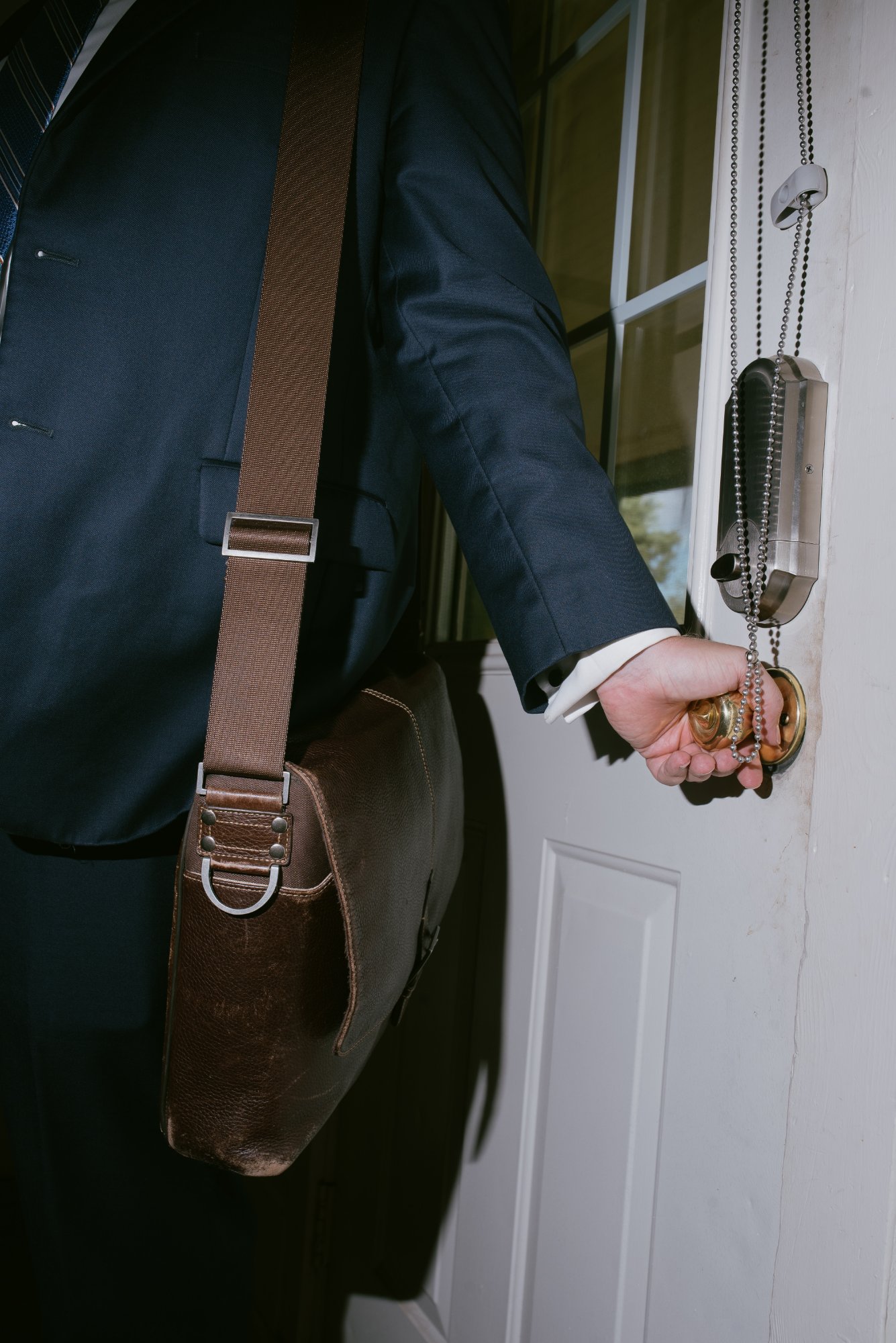 Shane O'Neal with briefcase and courthouse door